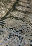 Détail motifs paisley et tissage doré sari indien vert