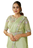 Sari vert pistache Arunika en satin avec broderies pastel – prêt-à-porter chic mariage.