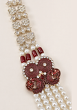 Detail ornement bordeaux et pierres mala homme Jahangir