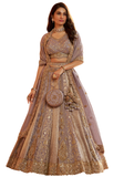 Lehenga de mariée Mauve et doré pour mariage indien